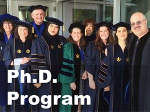 Photo of Ph.D. graduates with link to information about the Ph.D. program